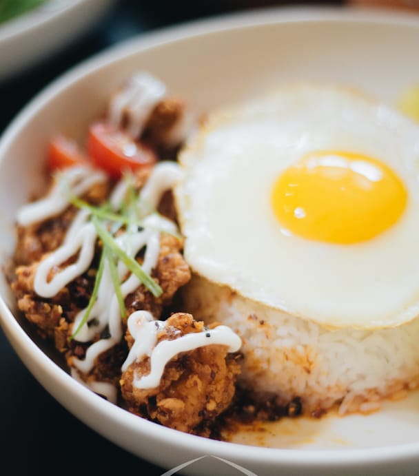 Spicy Kip Mayo Rice — fried chicken, rice, sunny-side egg, mayo drizzle, charred tomato